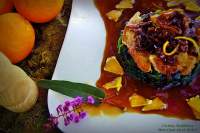   Secreto Ibérico en Salsa de Naranjas Sobre Lecho de Espinacas