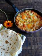   Huevos rancheros con carne picada en salsa gaucha