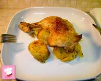   Muslos de pollo al horno sobre cama de patatas