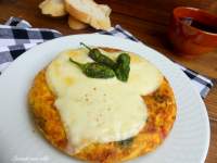   TORTILLA DE PATATAS CON PIMIENTOS DE PADRON Y CHORIZO, GRATINADA CON QUESO DE ARZUA  